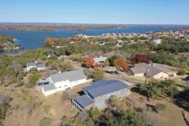 Perched on a scenic hilltop with sweeping views of Lake LBJ and on Apple Rock Golf Course - Horseshoe Bay in Texas - for sale on GolfHomes.com, golf home, golf lot