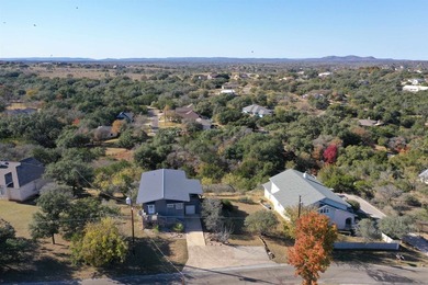 Perched on a scenic hilltop with sweeping views of Lake LBJ and on Apple Rock Golf Course - Horseshoe Bay in Texas - for sale on GolfHomes.com, golf home, golf lot