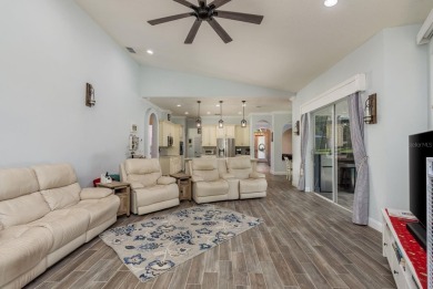 Experience refined Florida living at its finest in this on The Eagles Golf Course and Club in Florida - for sale on GolfHomes.com, golf home, golf lot