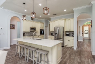 Experience refined Florida living at its finest in this on The Eagles Golf Course and Club in Florida - for sale on GolfHomes.com, golf home, golf lot
