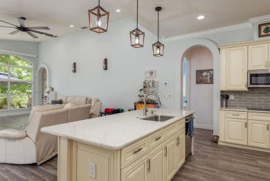 Experience refined Florida living at its finest in this on The Eagles Golf Course and Club in Florida - for sale on GolfHomes.com, golf home, golf lot