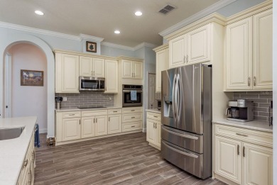Experience refined Florida living at its finest in this on The Eagles Golf Course and Club in Florida - for sale on GolfHomes.com, golf home, golf lot
