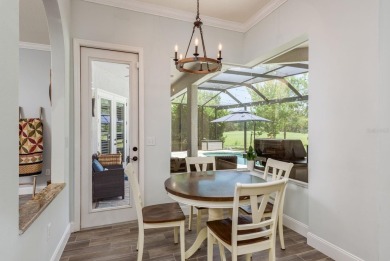 Experience refined Florida living at its finest in this on The Eagles Golf Course and Club in Florida - for sale on GolfHomes.com, golf home, golf lot