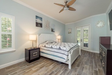 Experience refined Florida living at its finest in this on The Eagles Golf Course and Club in Florida - for sale on GolfHomes.com, golf home, golf lot