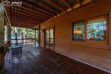 Nestled among towering pines in the prestigious Perry Park golf on Perry Park Country Club in Colorado - for sale on GolfHomes.com, golf home, golf lot