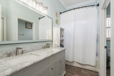 Experience refined Florida living at its finest in this on The Eagles Golf Course and Club in Florida - for sale on GolfHomes.com, golf home, golf lot
