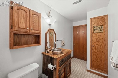 Nestled among towering pines in the prestigious Perry Park golf on Perry Park Country Club in Colorado - for sale on GolfHomes.com, golf home, golf lot