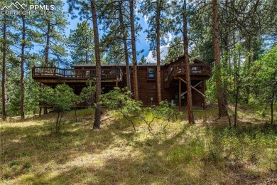 Nestled among towering pines in the prestigious Perry Park golf on Perry Park Country Club in Colorado - for sale on GolfHomes.com, golf home, golf lot