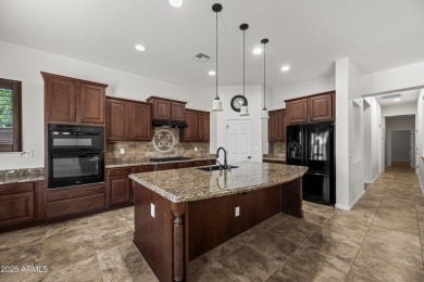Charming ranch home features 4 bedrooms plus a den. Step inside on Wigwam Golf  Resort Litchfield Park  in Arizona - for sale on GolfHomes.com, golf home, golf lot