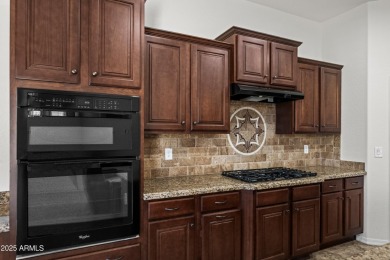 Charming ranch home features 4 bedrooms plus a den. Step inside on Wigwam Golf  Resort Litchfield Park  in Arizona - for sale on GolfHomes.com, golf home, golf lot