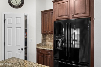 Charming ranch home features 4 bedrooms plus a den. Step inside on Wigwam Golf  Resort Litchfield Park  in Arizona - for sale on GolfHomes.com, golf home, golf lot