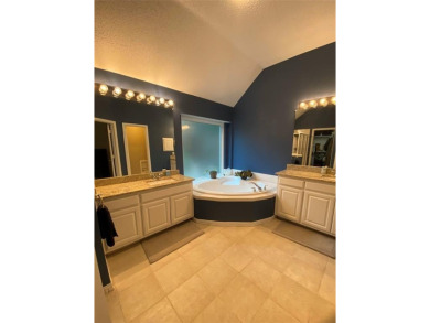 This single-story home, situated in a cul-de-sac, features three on The Golf Club at Fossil Creek in Texas - for sale on GolfHomes.com, golf home, golf lot