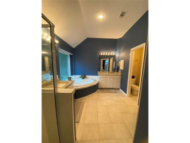 This single-story home, situated in a cul-de-sac, features three on The Golf Club at Fossil Creek in Texas - for sale on GolfHomes.com, golf home, golf lot