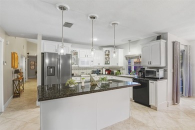 Welcome to this stunning 4-bedroom, 2-bath completely remodeled on Orange Tree Golf Club in Florida - for sale on GolfHomes.com, golf home, golf lot