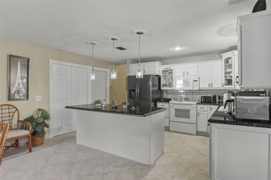 Welcome to this stunning 4-bedroom, 2-bath completely remodeled on Orange Tree Golf Club in Florida - for sale on GolfHomes.com, golf home, golf lot