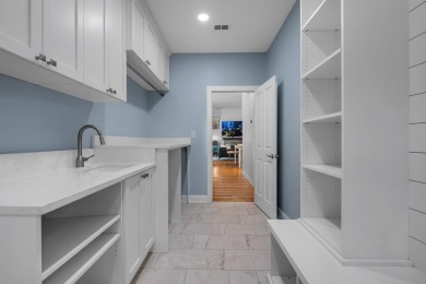Welcome to this stunning 5-bedroom, 4.5-bathroom completely on Golden Eagle Country Club in Florida - for sale on GolfHomes.com, golf home, golf lot