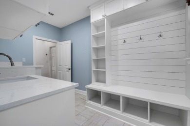 Welcome to this stunning 5-bedroom, 4.5-bathroom completely on Golden Eagle Country Club in Florida - for sale on GolfHomes.com, golf home, golf lot