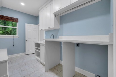 Welcome to this stunning 5-bedroom, 4.5-bathroom completely on Golden Eagle Country Club in Florida - for sale on GolfHomes.com, golf home, golf lot