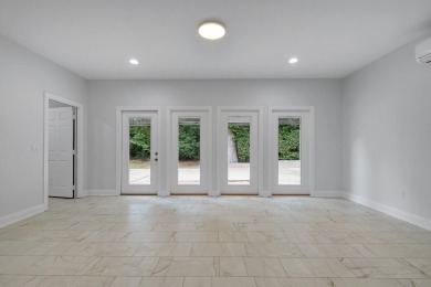 Welcome to this stunning 5-bedroom, 4.5-bathroom completely on Golden Eagle Country Club in Florida - for sale on GolfHomes.com, golf home, golf lot