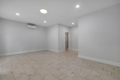 Welcome to this stunning 5-bedroom, 4.5-bathroom completely on Golden Eagle Country Club in Florida - for sale on GolfHomes.com, golf home, golf lot