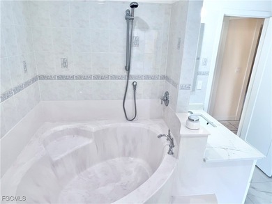 Vacation Rental or Personal Paradise! Investor-ready luxurious on Royal Tee Country Club in Florida - for sale on GolfHomes.com, golf home, golf lot