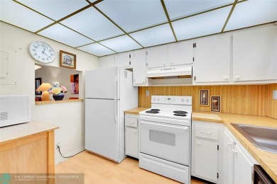 Beautiful, turn key, top corner condo, fully furnished located on Sunrise Lakes Phase III in Florida - for sale on GolfHomes.com, golf home, golf lot