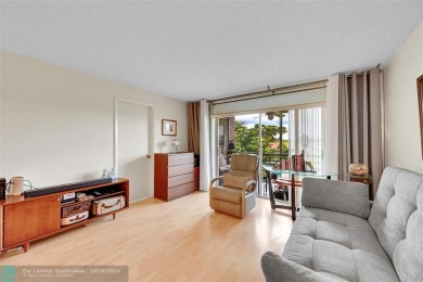 Beautiful, turn key, top corner condo, fully furnished located on Sunrise Lakes Phase III in Florida - for sale on GolfHomes.com, golf home, golf lot