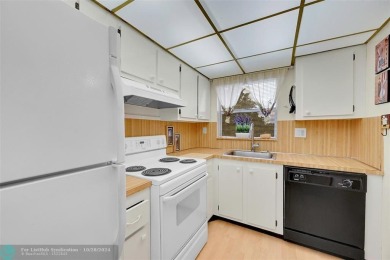 Beautiful, turn key, top corner condo, fully furnished located on Sunrise Lakes Phase III in Florida - for sale on GolfHomes.com, golf home, golf lot