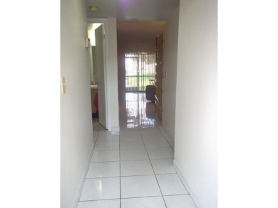 Discover this charming and conveniently located first-floor on Sunrise Lakes Phase IV Golf Course in Florida - for sale on GolfHomes.com, golf home, golf lot