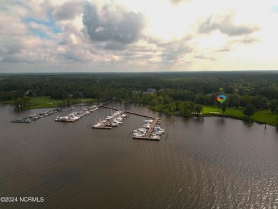 Beautiful sunset views over 17th hole, marina and Yeopim River on Sound Golf Links at Albemarle Plantation in North Carolina - for sale on GolfHomes.com, golf home, golf lot