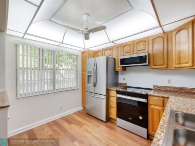 BRAND NEW VINYL FLOORING, NEVER-USED TOP-LINE SS APPLIANCES W/ on Wynmoor Golf Course in Florida - for sale on GolfHomes.com, golf home, golf lot