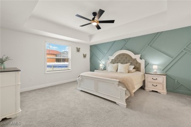 This beautifully designed four-bedroom home offers an on Palmetto-Pine Country Club in Florida - for sale on GolfHomes.com, golf home, golf lot