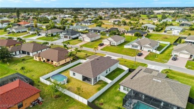 This beautifully designed four-bedroom home offers an on Palmetto-Pine Country Club in Florida - for sale on GolfHomes.com, golf home, golf lot