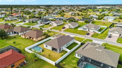 This beautifully designed four-bedroom home offers an on Palmetto-Pine Country Club in Florida - for sale on GolfHomes.com, golf home, golf lot
