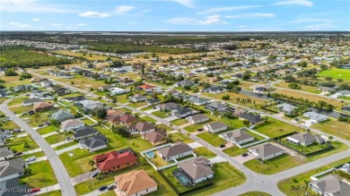 This beautifully designed four-bedroom home offers an on Palmetto-Pine Country Club in Florida - for sale on GolfHomes.com, golf home, golf lot