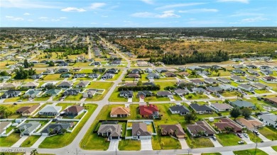 This beautifully designed four-bedroom home offers an on Palmetto-Pine Country Club in Florida - for sale on GolfHomes.com, golf home, golf lot