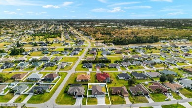 This beautifully designed four-bedroom home offers an on Palmetto-Pine Country Club in Florida - for sale on GolfHomes.com, golf home, golf lot