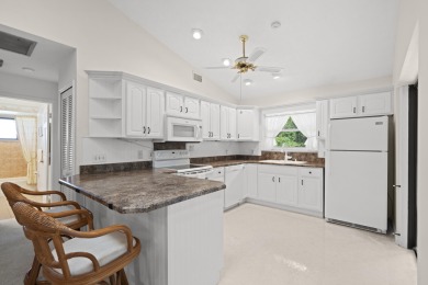 Charming CBS home in Country Club Cove, a quiet community of on Miles Grant Country Club in Florida - for sale on GolfHomes.com, golf home, golf lot