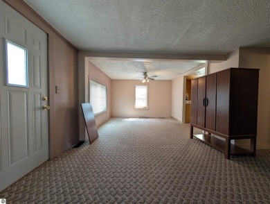 Charming Home Just 15 Minutes from Traverse City!  This on Interlochen Golf and Country Club in Michigan - for sale on GolfHomes.com, golf home, golf lot