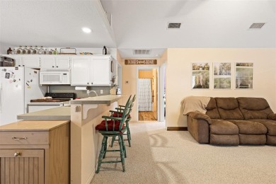 Enjoy this darling 2 bedroom & 2 bath home on two lots with two on Holly Lake Ranch Golf Club in Texas - for sale on GolfHomes.com, golf home, golf lot