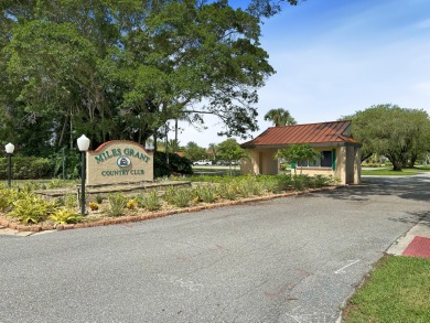 Charming CBS home in Country Club Cove, a quiet community of on Miles Grant Country Club in Florida - for sale on GolfHomes.com, golf home, golf lot