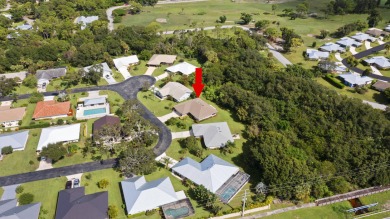 Charming CBS home in Country Club Cove, a quiet community of on Miles Grant Country Club in Florida - for sale on GolfHomes.com, golf home, golf lot