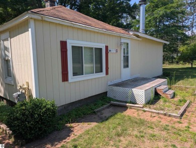 Charming Home Just 15 Minutes from Traverse City!  This on Interlochen Golf and Country Club in Michigan - for sale on GolfHomes.com, golf home, golf lot