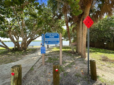 Charming CBS home in Country Club Cove, a quiet community of on Miles Grant Country Club in Florida - for sale on GolfHomes.com, golf home, golf lot