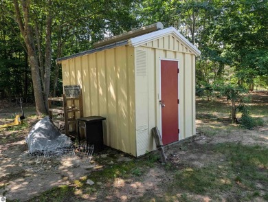 Charming Home Just 15 Minutes from Traverse City!  This on Interlochen Golf and Country Club in Michigan - for sale on GolfHomes.com, golf home, golf lot