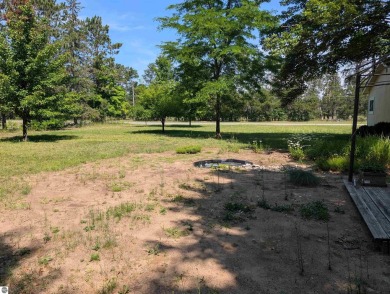 Charming Home Just 15 Minutes from Traverse City!  This on Interlochen Golf and Country Club in Michigan - for sale on GolfHomes.com, golf home, golf lot