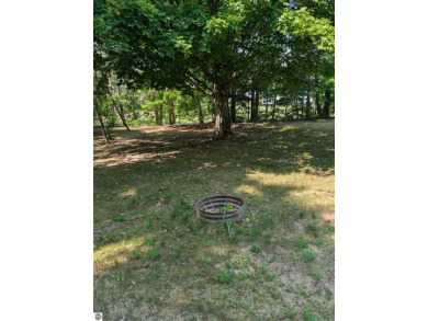 Charming Home Just 15 Minutes from Traverse City!  This on Interlochen Golf and Country Club in Michigan - for sale on GolfHomes.com, golf home, golf lot