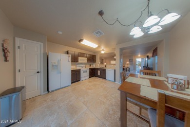 Take advantage of this rare opportunity to own an upgraded home on Dave White Reg Park and Golf Course in Arizona - for sale on GolfHomes.com, golf home, golf lot