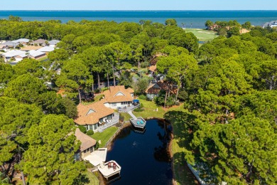Nestled on the pond in the sought-after Fairways community of on Sandestin Golf and Beach Resort - The Links in Florida - for sale on GolfHomes.com, golf home, golf lot