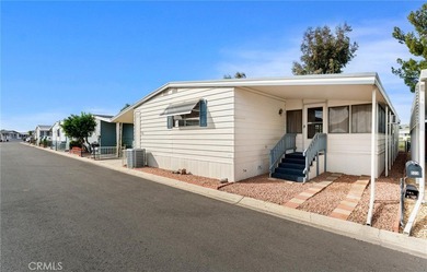 Step into your dream oasis with this exquisite 2-bedroom on Colonial Country Club in California - for sale on GolfHomes.com, golf home, golf lot